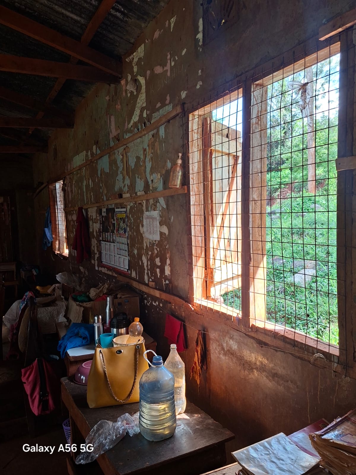 Inside a Karakuta classroom with worn walls and windows