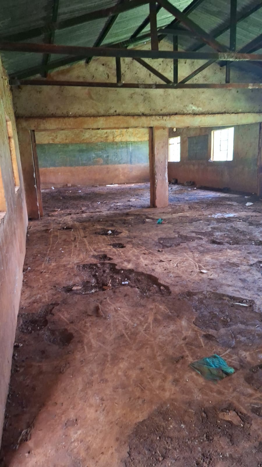 Wide view of an unfurnished Karakuta classroom