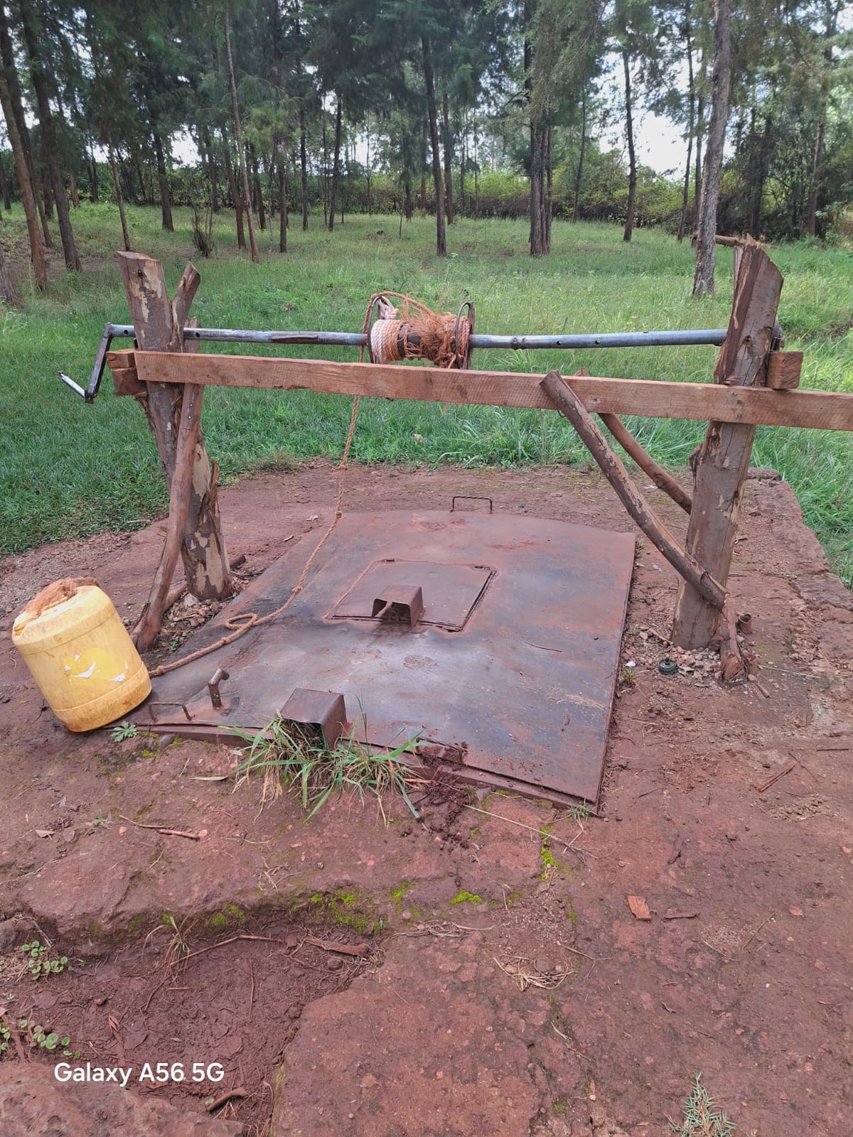 Hand-operated well and water container at Karakuta